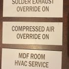 image of phenolic label & wall plates in white with cutout lettering